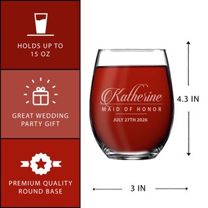 May include: A clear stemless wine glass filled with red liquid, featuring white etched text that reads Katherine, MAID OF HONOR, JULY 27TH 2026. The glass measures 4.3 inches in height and 3 inches in width, with a capacity of 15 ounces.