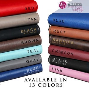 May include: Two stacks of rectangular items in 13 colours including red, tan, black with gold, brown, teal, grey, blue with silver, blue, rust, rawhide with gold, crimson, black with silver, and pink. Text reads: THE WEDDING PARTY STORE AVAILABLE IN 13 COLOURS.