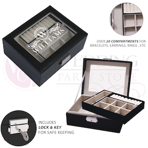 May include: A black jewelry box with a glass lid featuring the white text "W WILLIAMS" and a decorative flourish. The box includes a removable tray with multiple compartments, a beige interior, and a silver metal lock with a key for security.
