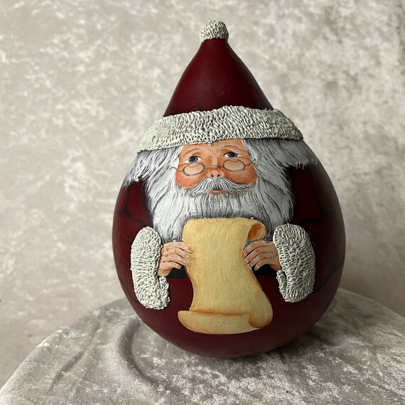 Hand painted Santa on a dried and preserved Gourd.  Can be personalized and a great gift for grandparents as a family heirloom