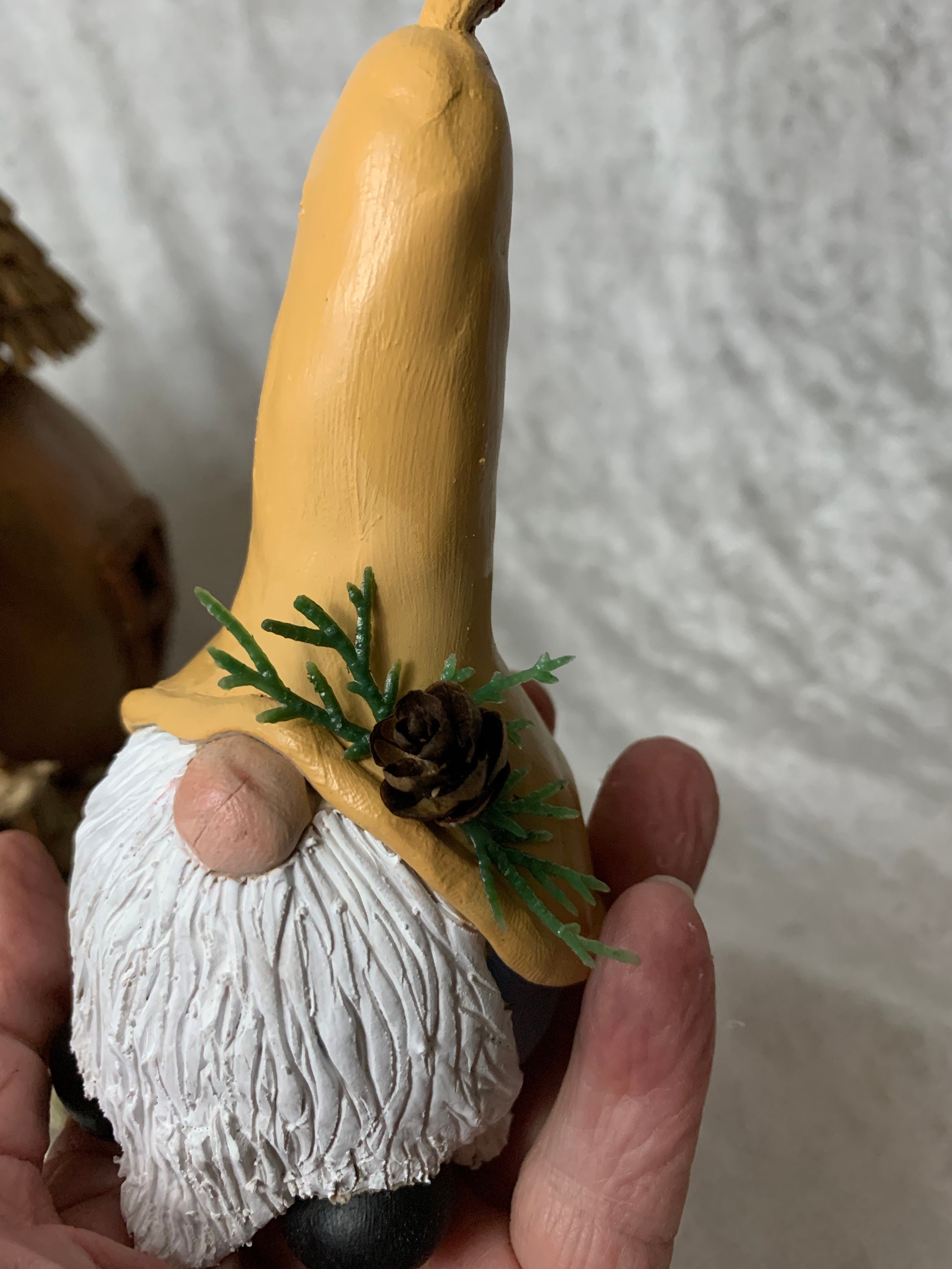 Whimsical little gnome, looking for a new home. He is made out of a