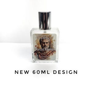 May include: A clear glass perfume bottle with a silver cap, featuring a label with an illustration of Marcus Aurelius, the text "INTERNAL FRAGRANCES", "Marcus Aurelius", "Eau de Parfum", "60ml 2 fl oz", and "NEW 60ML DESIGN".