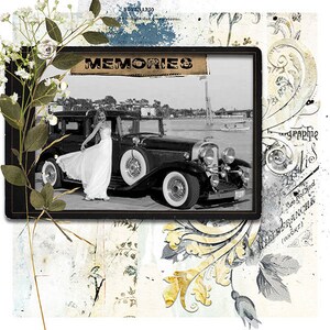 May include: A black and white photograph of a woman in a white dress standing next to a vintage car. The photo is framed in black and has the word "MEMORIES" printed on it in a vintage style font.