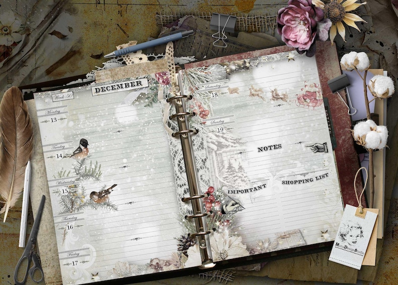 An open ring-bound planner with a winter theme featuring the text DECEMBER, Week 50, and days of the week from Monday 13 to Sunday 19. The pages include sections for NOTES, IMPORTANT, and SHOPPING LIST, decorated with birds, pine branches, and snow.