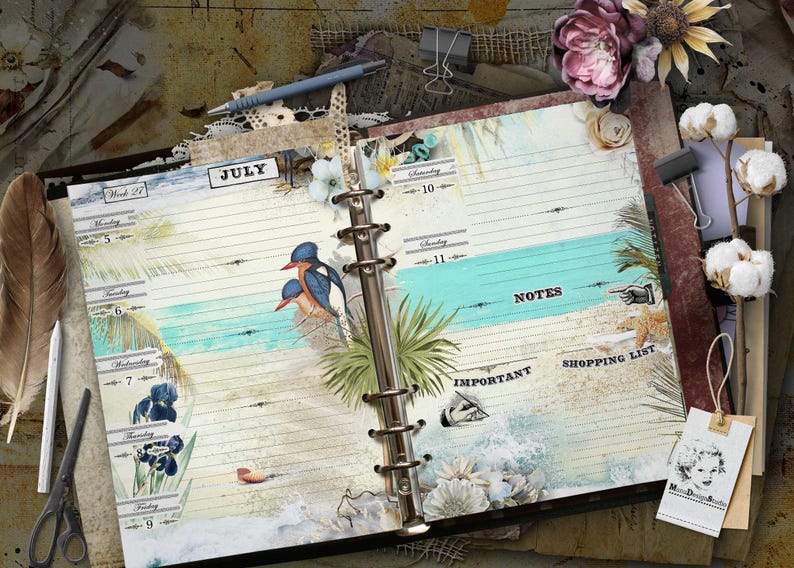 An open ring-bound planner featuring a July calendar layout with beach-themed illustrations, including birds, palm leaves, and seashells. The pages contain printed text for days of the week, notes, shopping list, and important sections.