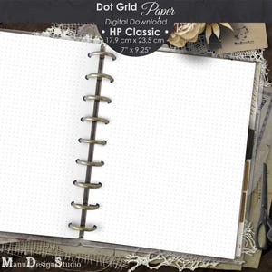 May include: Open notebook with dot grid paper, ideal for journaling or note-taking. The pages are held together by a metal ring binder. The paper measures 7 inches by 9.25 inches. The top of the image has the text "Dot Grid Paper" and "HP Classic".