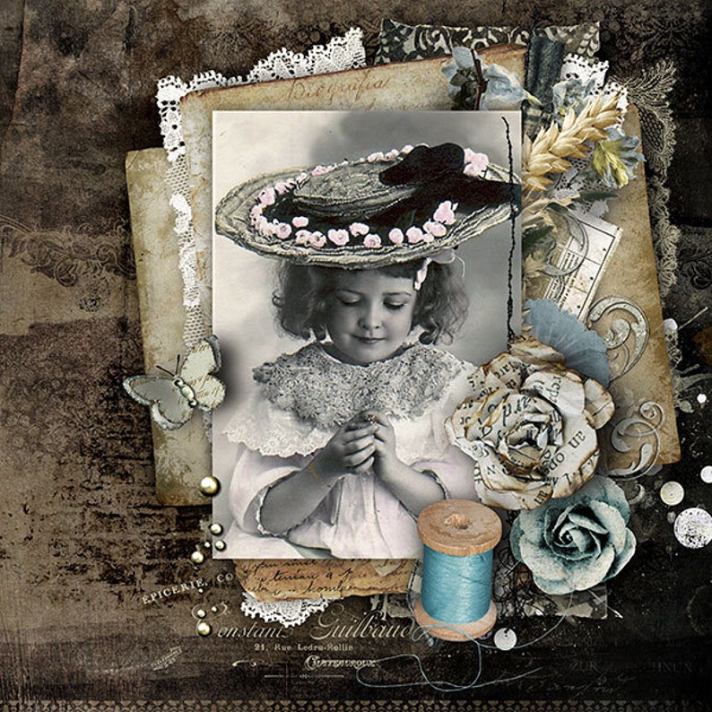 May include: A vintage photograph of a young girl wearing a large, wide-brimmed hat with pink flowers. The photo is surrounded by lace, paper, and other decorative elements, including a spool of blue thread and a blue rose.