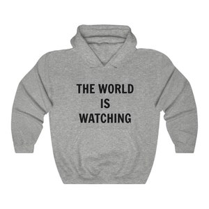 Sweat-shirt à capuche unisexe en mélange épais Le monde nous regarde