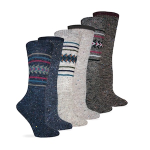 May include: Five pairs of knee-high socks in various colors and patterns. The socks are made of a soft, fuzzy material and feature a geometric design.