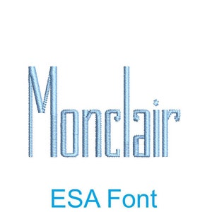 May include: The word "Monclair" is embroidered in a light blue thread on a white background. The text is in a font called "ESA Font".