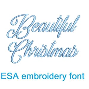 May include: A white background with the words "Beautiful Christmas" in light blue script. Below the words is the text "ESA embroidery font" in a darker blue color.