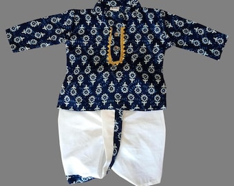 May include: A blue and white patterned kurta with a gold trim and a white dhoti. The kurta has a button closure at the neck.
