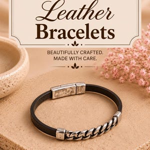 a handmade leather bracelet with a chain-link design, placed on a beige surface.