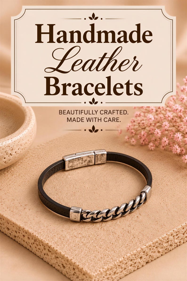 a handmade leather bracelet with a chain-link design, placed on a beige surface.