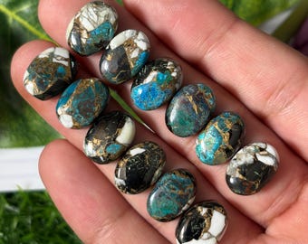 Cabujón ovalado de turquesa blanca búfalo y Kingman de 10 x 14 mm