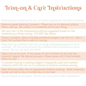 May include: A cream-coloured page with the headline "Iron-on & Care Instructions" in a decorative font. The text provides detailed instructions for applying iron-on transfers, including ironing temperature, pressure, and washing guidelines. The instructions are in a clear, easy-to-read format.