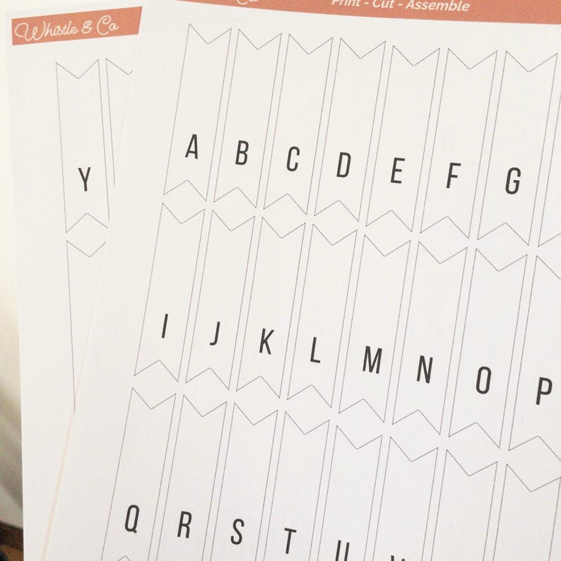 May include: Printable alphabet letter flags for a banner. Each letter is printed on a white pennant with a black outline. The letters are A through Y.