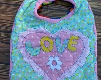 Infant baby bib, quilted, double sided with velcro closure