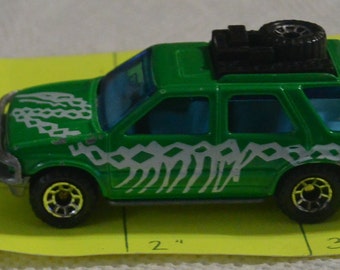 1994 Brontosaurus green SUV with spare tire and toolbox matchbox