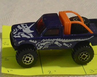 1981 Matchbox 4x4 open back truck with dinosaur skeleton, purple