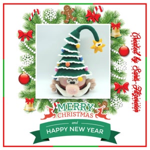 May include: A crocheted Christmas gnome wearing a green Christmas tree hat with lights and a star on top. The gnome has a white beard and a red nose. The background is a wreath of green pine branches with red and white ornaments.