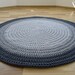 see more listings in the Gray round rug section