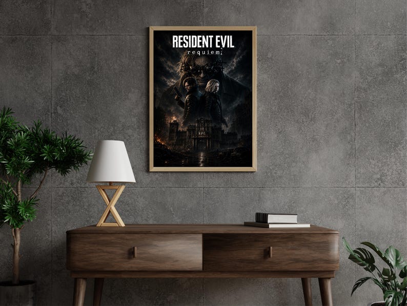 May include: A rectangular wall poster in a light wood frame featuring the text RESIDENT EVIL requiem. The artwork displays two figures standing back-to-back in front of a dark, gothic mansion under a stormy, cloud-filled sky with fiery orange accents.