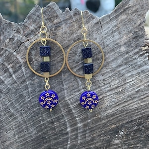 Brass hoops with navy blue goldstone beads and acrylic moon and star beads