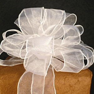 May include: White sheer ribbon bow, perfect for adding a touch of elegance to gifts or crafts.