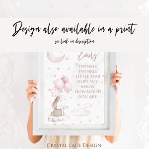 May include: A framed print with a pink and white watercolor illustration of a bunny holding balloons in front of a moon and stars. The text "Emily" and "Twinkle Twinkle Little Star Hope You Know How Loved You Are" is printed on the print.