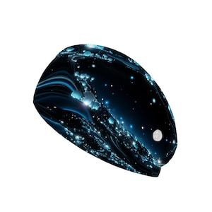 May include: A black and blue headband with a cosmic design. The headband features a swirling pattern of blue and white lights against a dark background, with a small white button on the side.