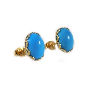 May include: A pair of gold earrings with blue oval-shaped turquoise stones set in a gold filigree design.