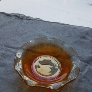 Small MARIGOLD CARNIVAL glass bowl . Leaf design on iridescent background . Jeannette Glass Company
