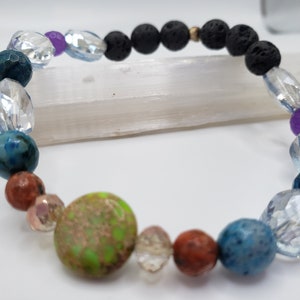 Natural stone and crystal stretch bracelet with crazy lace agate, black lava, agate, and ocean jasper.
