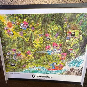 May include: A colorful illustration of cartoon gnomes using Commodore computers in a jungle setting. The text "A Byte of Whimsy" and the Commodore logo are at the bottom of the image.