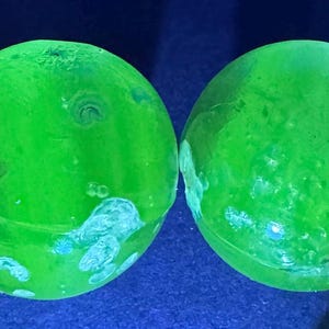 4 Antique Uranium Clear Glass/Phosphorus 2 1/4&quot; Marbles (No internal shapes)