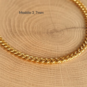 May include: A gold chain necklace with a curb link style. The chain is 3.7mm wide.  Mod&egrave;le 3_7mm