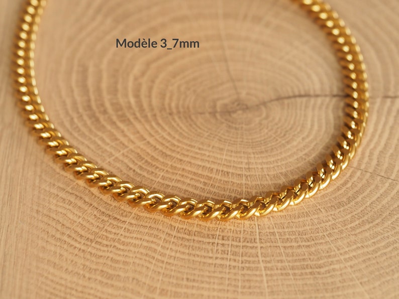 May include: A gold chain necklace with a curb link style. The chain is 3.7mm wide.  Mod&egrave;le 3_7mm