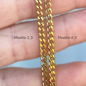 May include: Two gold chains, side by side, labeled "Mod&egrave;le 3_3" and "Mod&egrave;le 4_3". The chains are both curb chains, but the chain labeled "Mod&egrave;le 4_3" is thicker than the chain labeled "Mod&egrave;le 3_3".