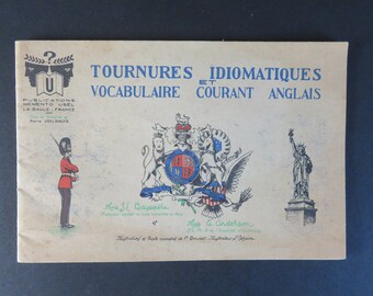 May include: A vintage book cover with the title "Tournures Idiomatiques et Vocabulaire Courant Anglais" in blue text. The cover features illustrations of a British soldier, the royal coat of arms, and the Statue of Liberty.