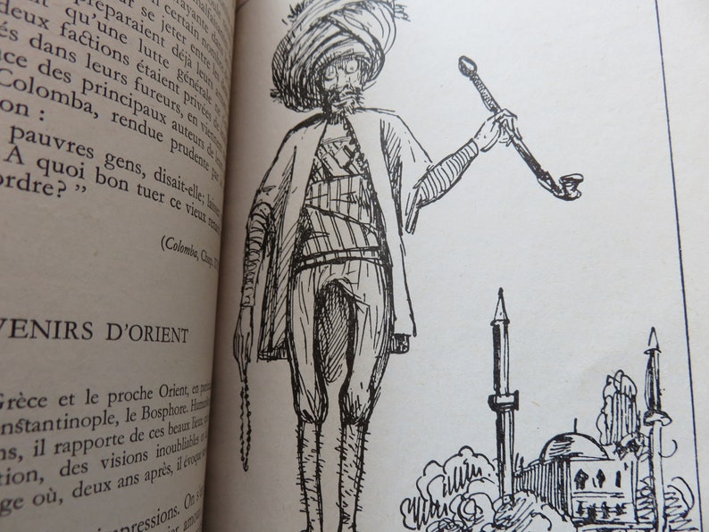 May include: A black and white line drawing of a man in a turban and long robe holding a pipe. The man is standing in front of a mosque with minarets.