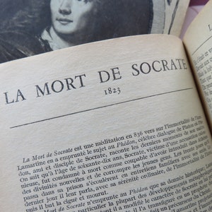 May include: A close-up of a book titled "La Mort de Socrate" with the year 1823 printed below the title. The book is open to a page with text about the death of Socrates.