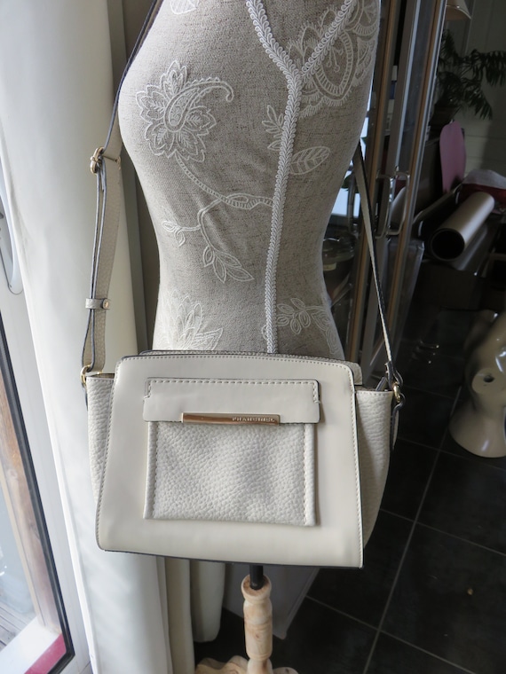 cream colored crossbody bag
