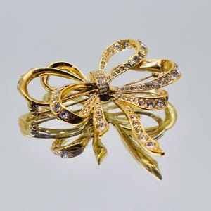 Broche KJL para Avon