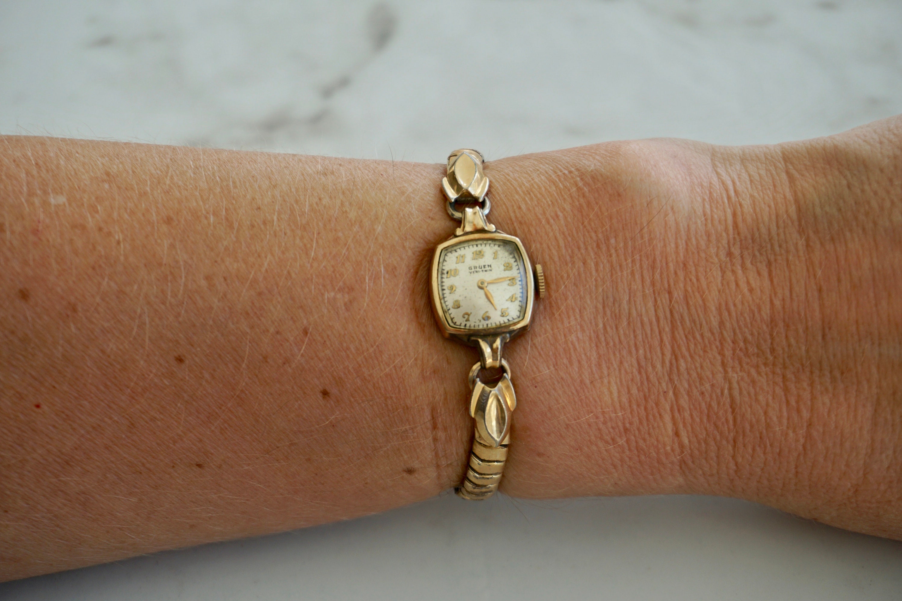 Thin gold watch women's sales
