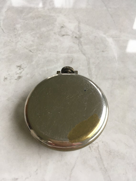 Ingersoll pocket watch runs but missing minute hand a… Gem