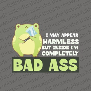 I may appear harmless but inside I am completely Bad Ass frog with cleaver two files png white letters, black letters clear background