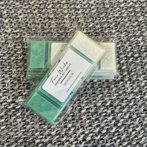 May include: A set of three wax melts in clear packaging. The wax melts are green and have a white label that says "Four Wicks Handmade Soy Candles French Pear www.fourwicksoycandles.com".