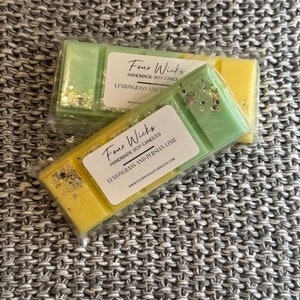 May include: Two wax melts, one green and one yellow, with a label that reads "Four Wicks Handmade Soy Candles Lemongrass and Persian Lime" and a website address.