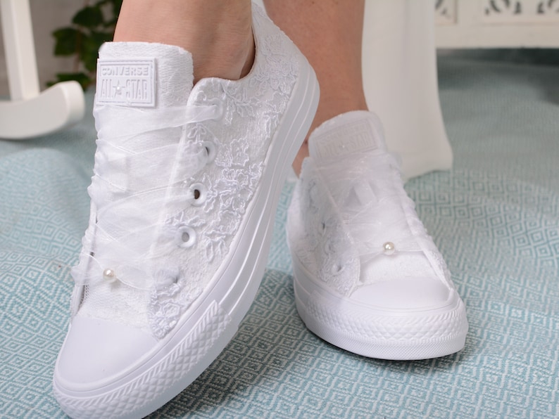 Elegant lace-adorned white Converse for the stylish bride. Customizable low-top tennis shoes featuring exquisite Dubai lace, perfect for a luxurious wedding ensemble